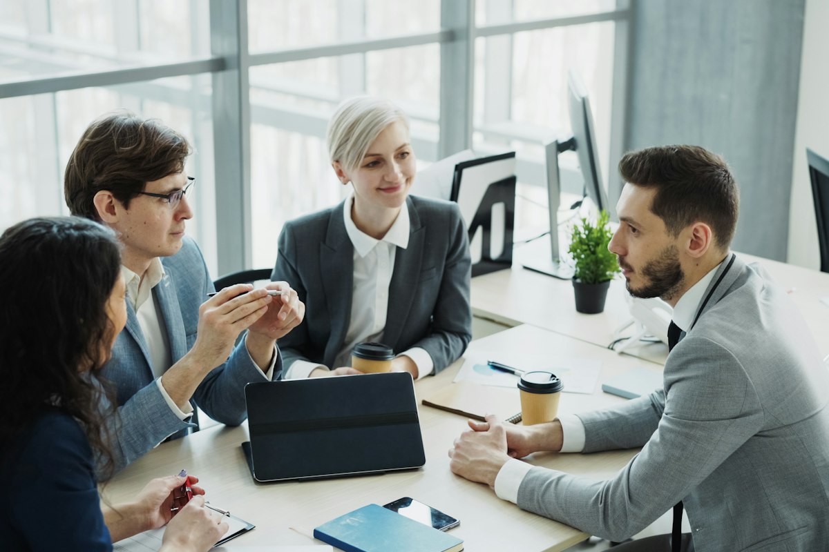 A business team working through a plan together