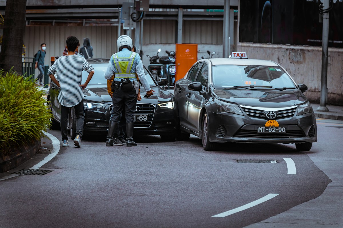 A driver and an officer at a roadside collision