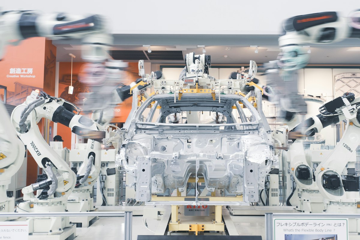 Robotic arms assembling a car body on a production line