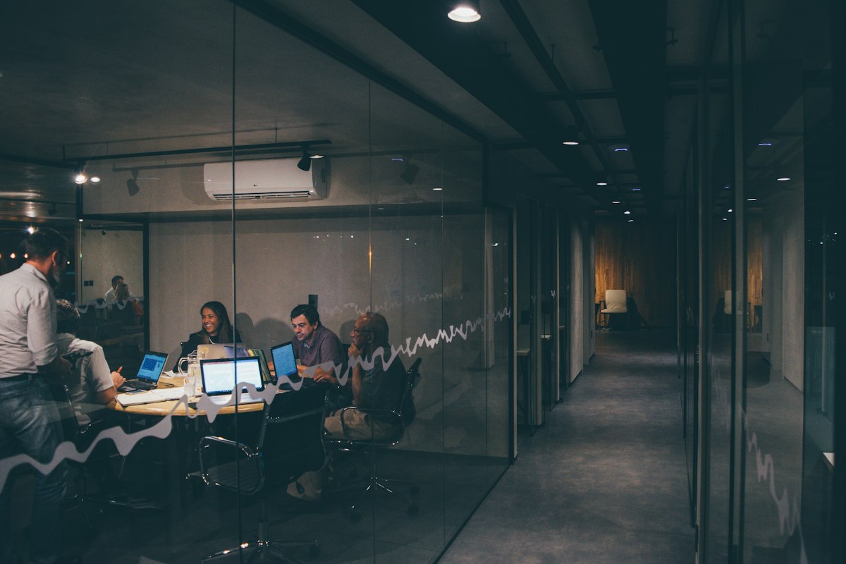 A team reviewing figures together in a meeting room