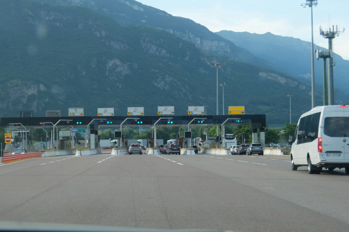Cars approaching a toll and border plaza
